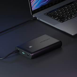 alt="A laptop connected to Onyx 10050mAh PD 35W Power Bank"